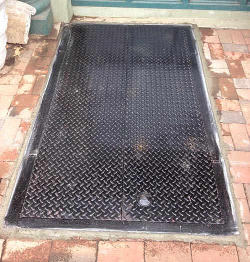 grated steel cellar door