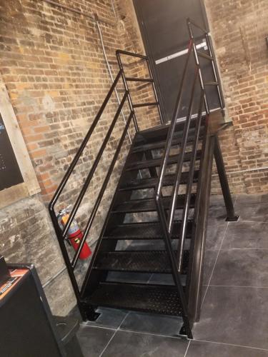 diamond plate iron stairs with piperails